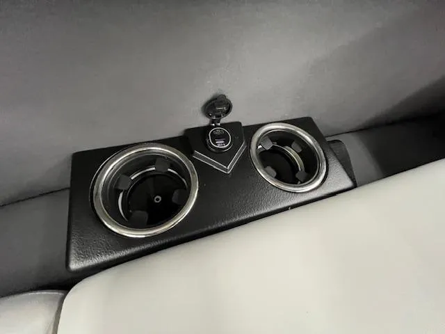 Slide: The Image of Cup holders and USB port in 2025 Harris Cruiser 210 boat interior. - 17
