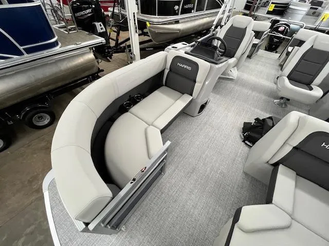 Slide: The Image of 2025 Harris Cruiser 210 pontoon boat interior with plush seating and modern design. - 18
