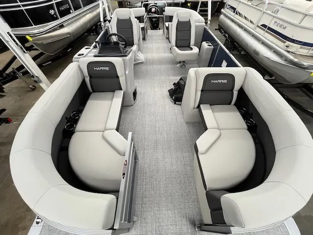 Slide: The Image of 2025 Harris Cruiser 210 pontoon boat interior with plush seating and modern design. - 20