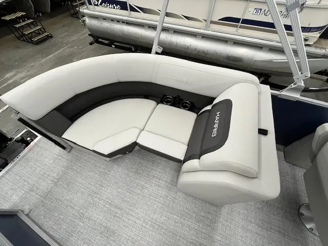 Slide: The Image of 2025 Harris Cruiser 210 pontoon boat interior with plush seating and cup holders. - 6