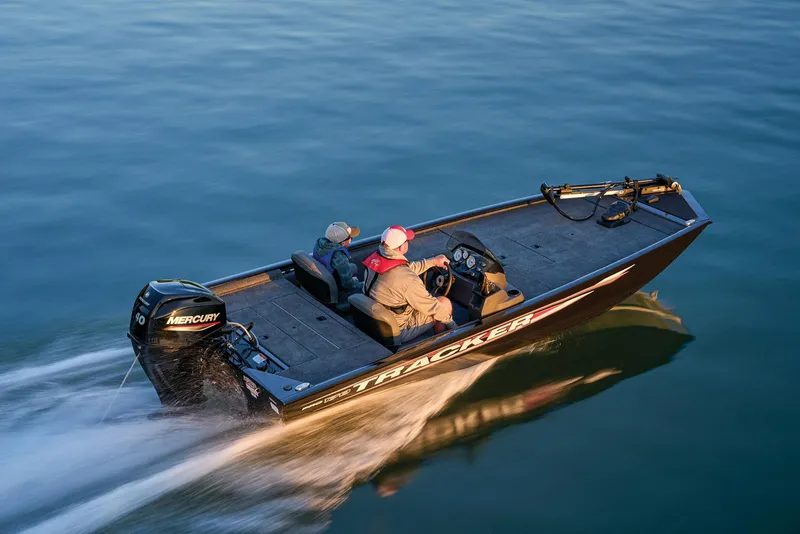 Slide: The Image of Manufacturer Provided Image: 2026 Tracker Pro 170 boat cruising on calm water, featuring a Mercury outboard motor. - 47