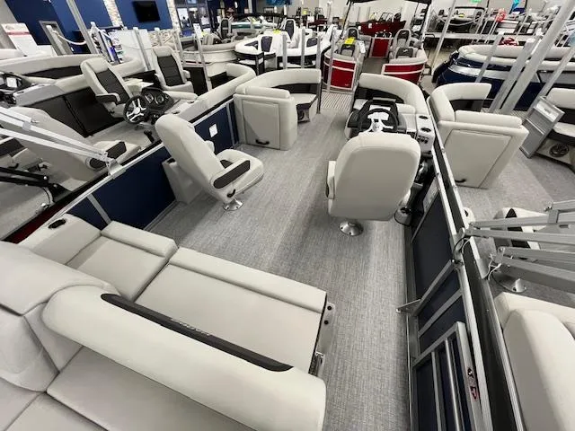 Slide: The Image of 2025 Harris Cruiser 210 pontoon boat interior with plush seating and modern design. - 10