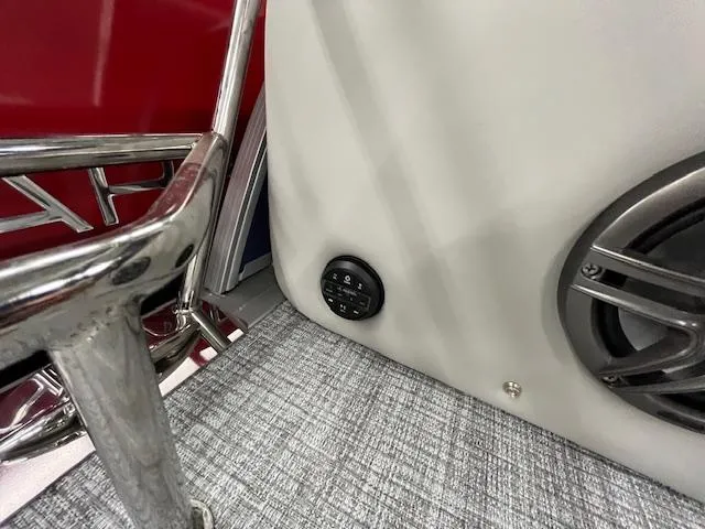 Slide: The Image of 2025 Harris Cruiser 210 interior with speaker and control panel. - 13