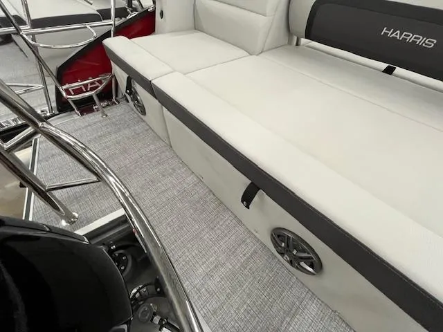Slide: The Image of 2025 Harris Cruiser 210 interior with white seating and modern design. - 14