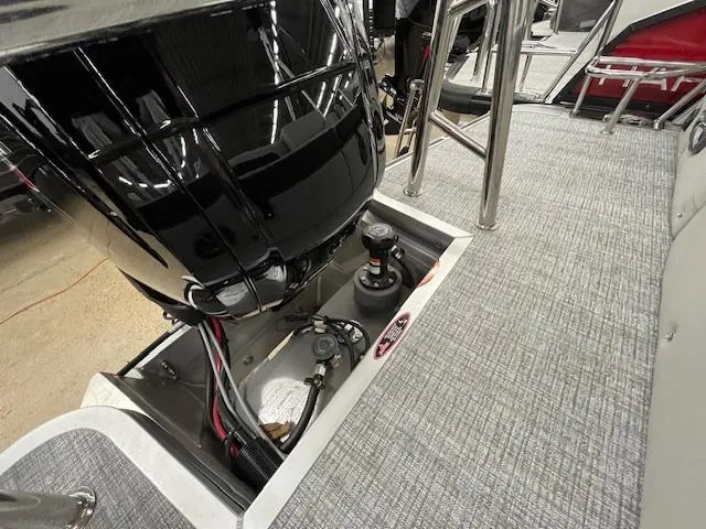 Slide: The Image of 2025 Harris Cruiser 210 boat engine compartment with wiring and components. - 15