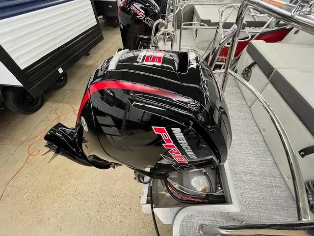 Slide: The Image of 2025 Harris Cruiser 210 with Mercury Pro outboard motor, docked and ready for adventure. - 16