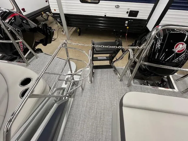 Slide: The Image of 2025 Harris Cruiser 210 boat interior with seating and railing, showcasing modern design. - 17