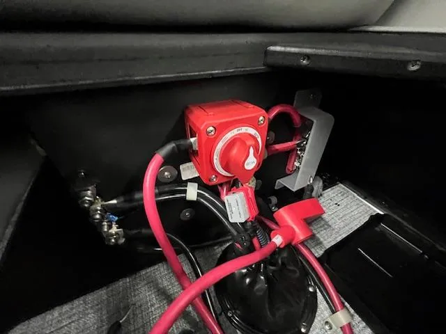 Slide: The Image of Battery switch and wiring inside 2025 Harris Cruiser 210 boat. - 18
