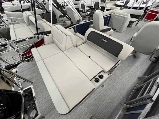 Slide: The Image of 2025 Harris Cruiser 210 boat interior with plush seating and modern design. - 20