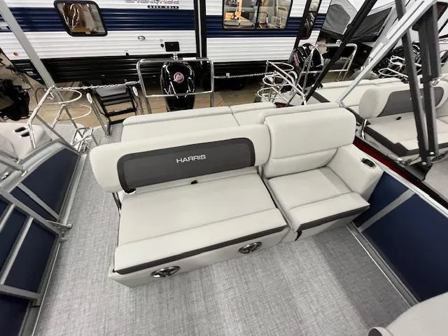 Slide: The Image of 2025 Harris Cruiser 210 boat interior with gray seating and modern design. - 21
