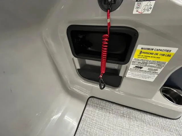 Slide: The Image of 2025 Harris Cruiser 210 interior with safety features and capacity label. - 22