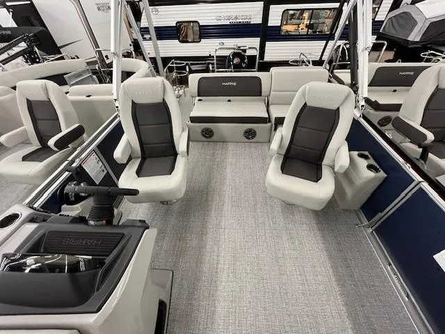 Slide: The Image of 2025 Harris Cruiser 210 boat interior with plush seating and modern design. - 5