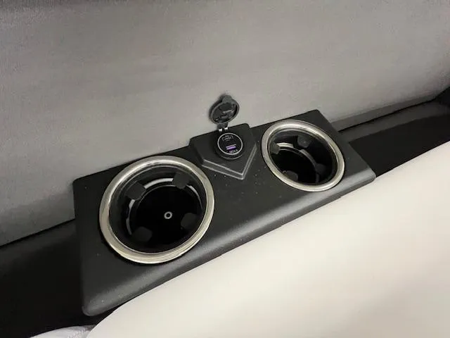 Slide: The Image of Cup holders and USB port in 2025 Harris Cruiser 210 boat interior. - 6