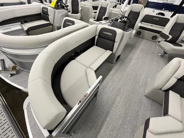 Slide: The Image of 2025 Harris Cruiser 210 pontoon boat interior with plush seating and modern design. - 7