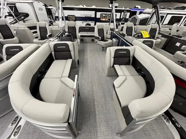 Slide: The Image of 2025 Harris Cruiser 210 pontoon boat interior with plush seating and modern design. - 9