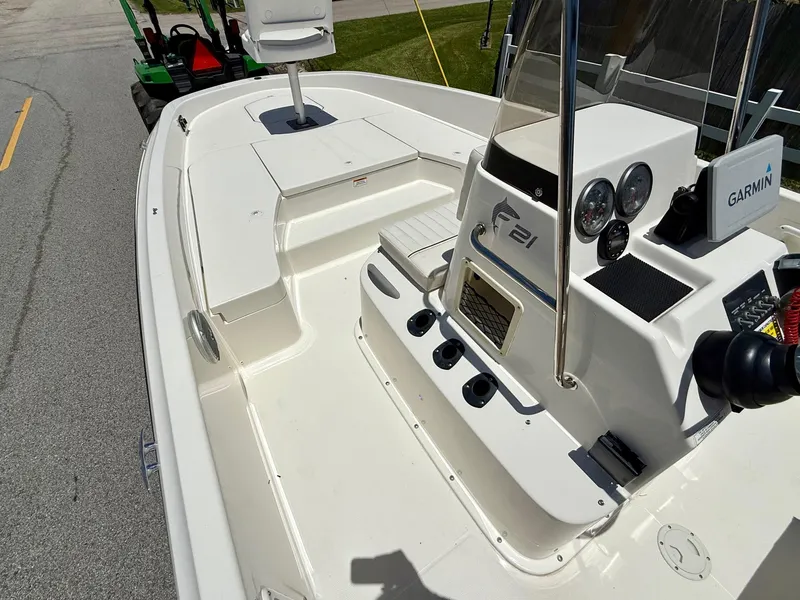 Slide: The Image of 2020 Bayliner Element F21 boat interior with Garmin navigation system. - 12