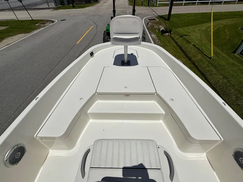 Slide: The Image of 2020 Bayliner Element F21 boat interior with seating and storage compartments. - 13