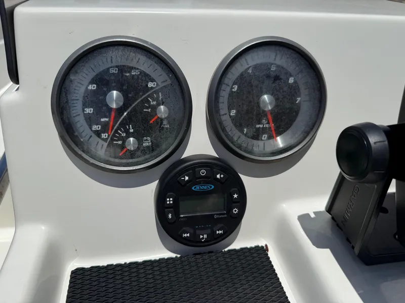 Slide: The Image of Dashboard of 2020 Bayliner Element F21 boat with gauges and controls. - 17