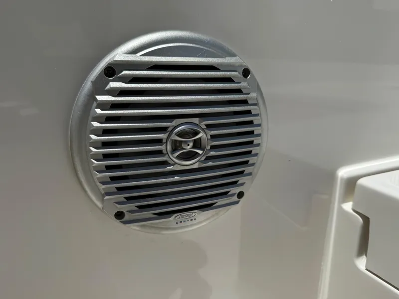 Slide: The Image of Close-up of a speaker on a 2020 Bayliner Element F21 boat. - 18