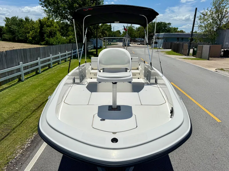 Slide: The Image of 2020 Bayliner Element F21 boat on a road, featuring a central seat and canopy. - 6