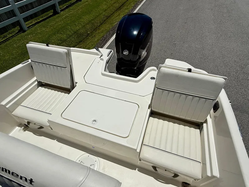 Slide: The Image of 2020 Bayliner Element F21 boat interior with seating and outboard motor. - 7