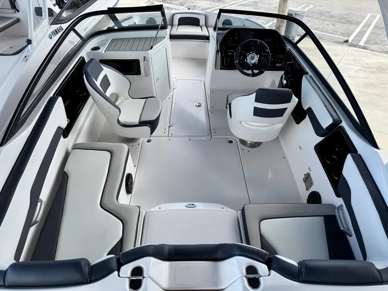 Slide: The Image of 2025 Yamaha Boats 195S interior, featuring sleek seating and modern dashboard design. - 6