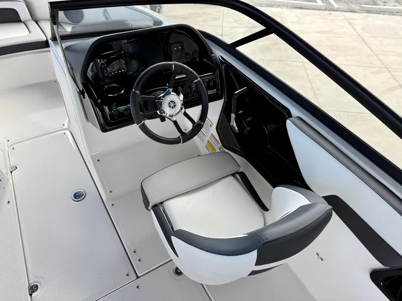 Slide: The Image of 2025 Yamaha Boats 195S cockpit with steering wheel and modern dashboard. - 7