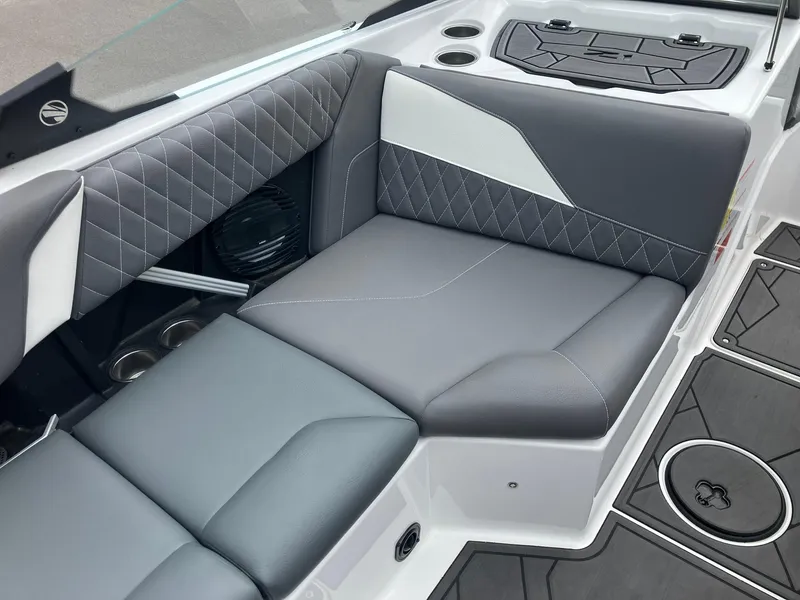 Slide: The Image of 2023 Tigé Z1 boat interior with gray and white cushioned seating. - 10