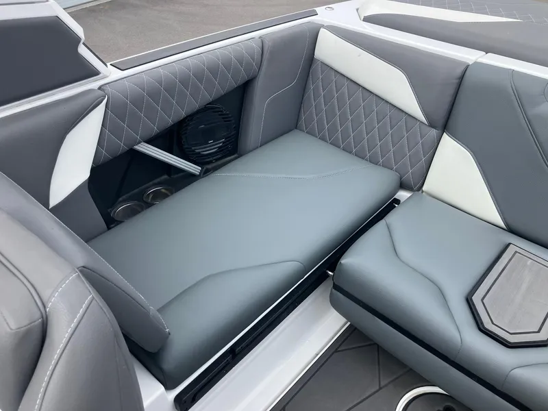Slide: The Image of 2023 Tigé Z1 boat interior with gray and white cushioned seating. - 8
