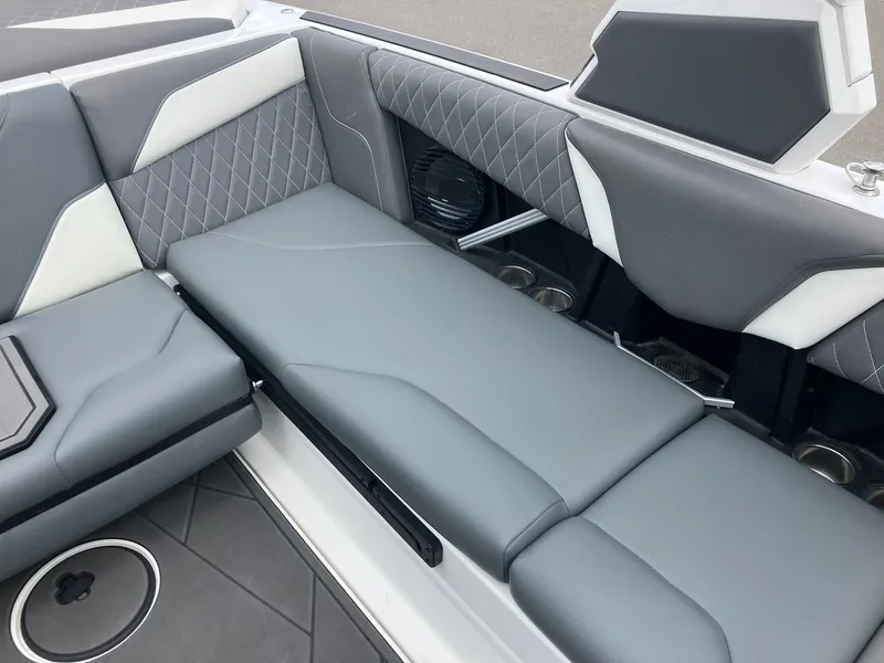 Slide: The Image of 2023 Tigé Z1 boat interior with gray and white cushioned seating. - 9