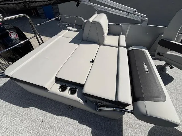 Slide: The Image of 2025 Harris Cruiser 210 boat with spacious seating and cup holders. - 15