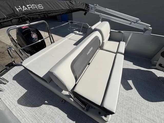 Slide: The Image of 2025 Harris Cruiser 210 boat with comfortable seating and sleek design. - 17