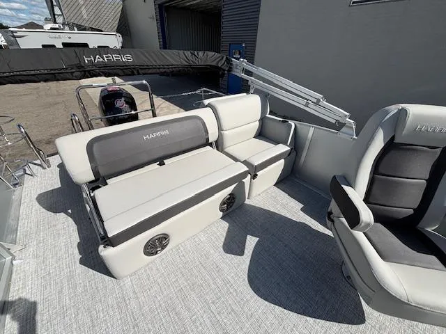 Slide: The Image of 2025 Harris Cruiser 210 boat interior with plush seating and modern design. - 18