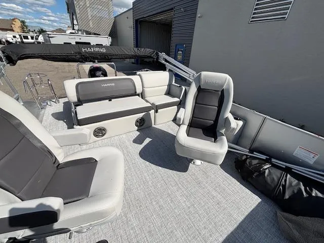 Slide: The Image of 2025 Harris Cruiser 210 boat interior with plush seating and modern design. - 19