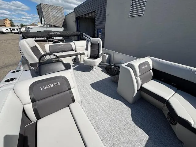 Slide: The Image of 2025 Harris Cruiser 210 pontoon boat with spacious seating and modern design. - 21