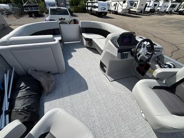 Slide: The Image of 2025 Harris Cruiser 210 pontoon boat interior with modern seating and steering console. - 6