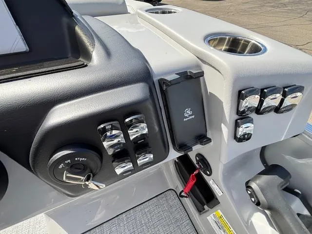 Slide: The Image of Control panel of 2025 Harris Cruiser 210 boat with ignition and switches. - 9