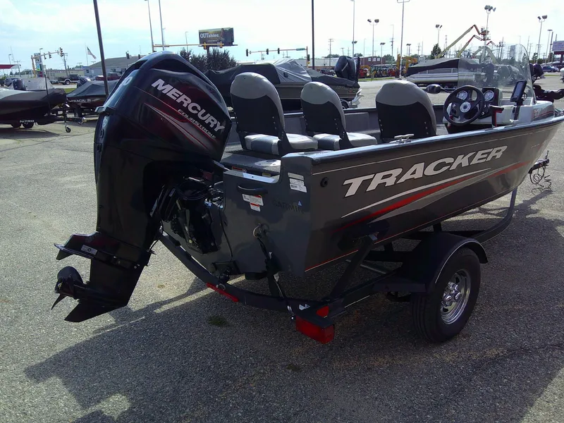 Slide: The Image of 2017 Tracker Pro Guide V-16 SC boat with Mercury outboard motor in a dealership lot. - 3