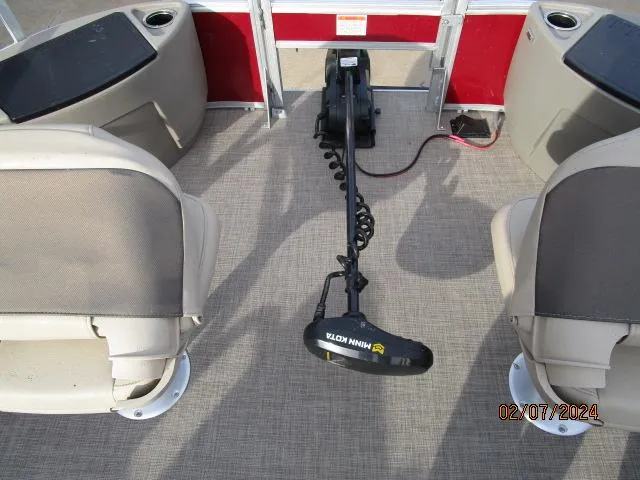 Slide: The Image of 2023 Sun Tracker Bass Buggy interior with Minn Kota trolling motor and seating. - 8