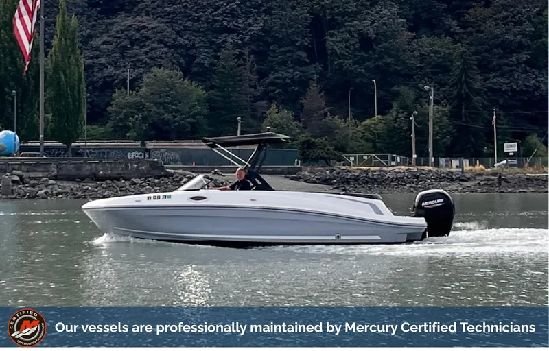 Slide: The Image of 2021 Bayliner VR6 boat cruising on a river, maintained by Mercury Certified Technicians. - 0