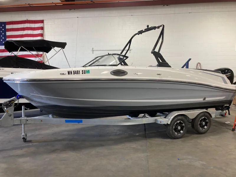 Slide: The Image of 2020 Bayliner VR6 boat on trailer in indoor storage. - 1
