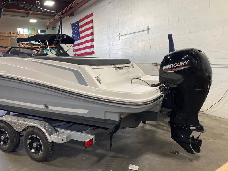 Slide: The Image of 2020 Bayliner VR6 boat with Mercury engine on trailer in garage. - 11