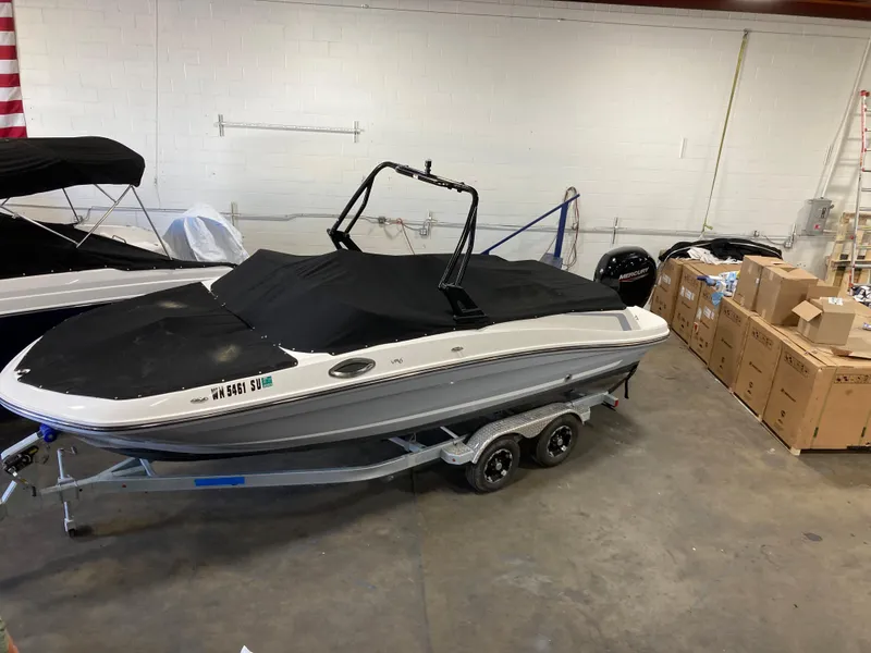 Slide: The Image of 2020 Bayliner VR6 boat with cover in storage facility. - 15