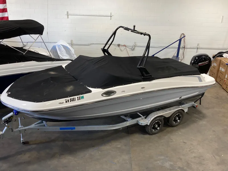 Slide: The Image of 2020 Bayliner VR6 boat on trailer, covered and stored indoors. - 16