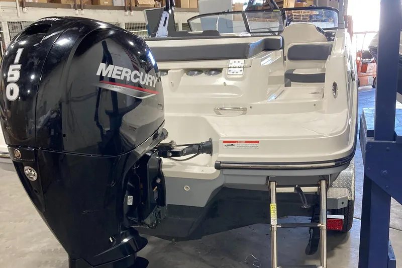 Slide: The Image of 2020 Bayliner VR6 boat with Mercury 150 outboard motor in a garage. - 17