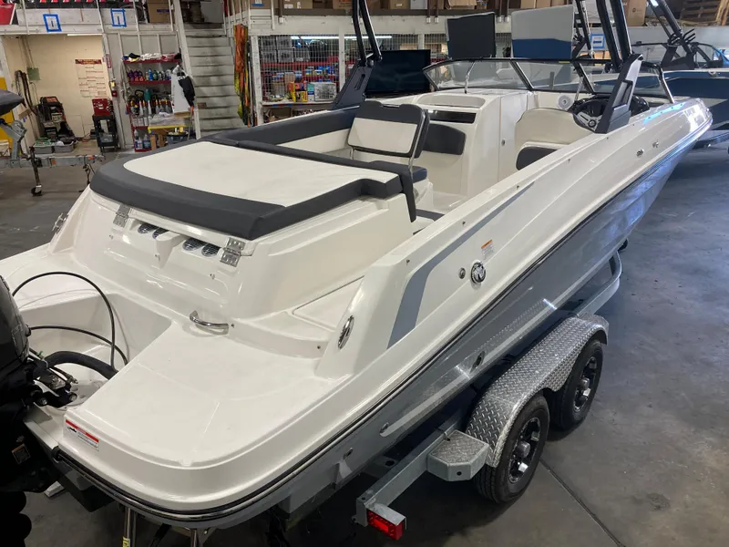 Slide: The Image of 2020 Bayliner VR6 boat on trailer in indoor storage facility. - 2