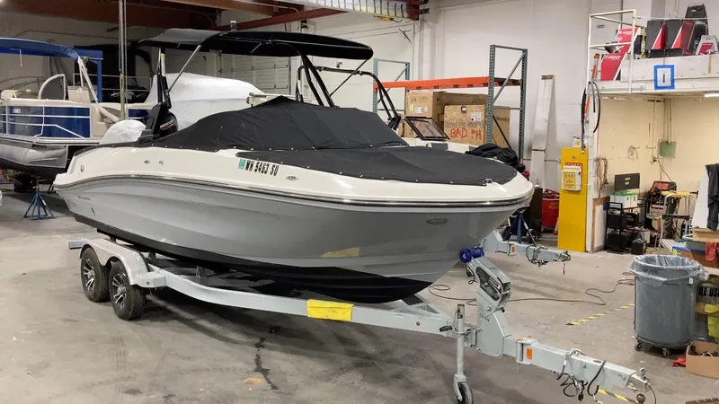 Slide: The Image of 2020 Bayliner VR6 boat on trailer in indoor storage facility. - 24
