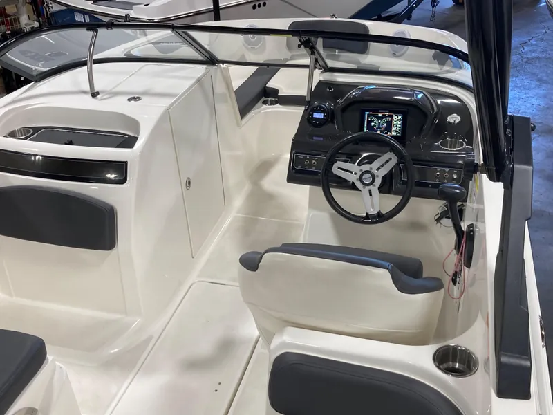 Slide: The Image of 2020 Bayliner VR6 boat interior with steering wheel and dashboard controls. - 4
