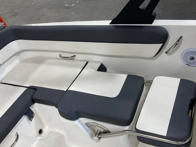 Slide: The Image of 2020 Bayliner VR6 boat interior seating with sleek black and white design. - 6