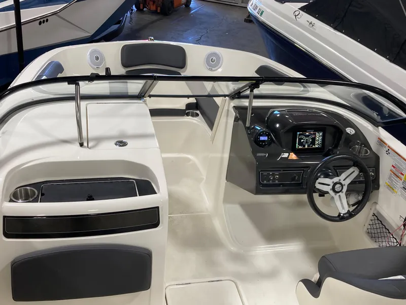 Slide: The Image of 2020 Bayliner VR6 boat interior with steering wheel and dashboard controls. - 7